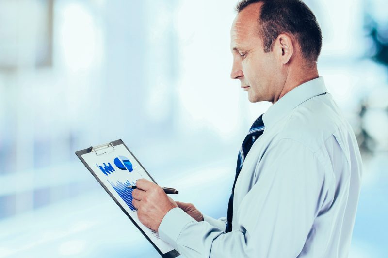 accounting-investor-with-financial-plan-revenues-scaled.jpg